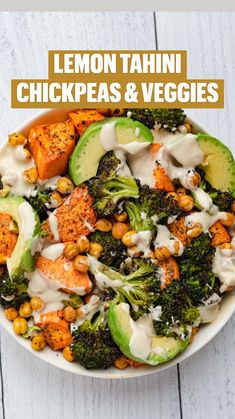 a bowl filled with broccoli, carrots and chickpeas covered in ranch dressing