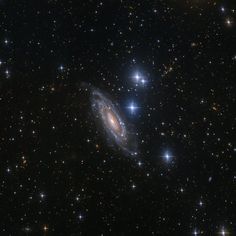 an image of a spiral galaxy in the sky