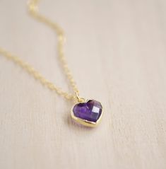 Give yourself some love or show your love for that special someone in your life with this heart necklace!Amethyst is believed to carry the energies of passion, creativity, and spirituality. It's also said to assist with temperance and sobriety, as well as inflammation.This necklace is handcrafted with a purple Amethyst faceted heart pendant. Each stone is natural and therefore contains natural inclusions or crystal formations. They are edged in 24k gold or silver electroplate. STONE SIZE: averag Dainty Heart-shaped Birthstone Necklace With Gemstone, Heart-shaped Amethyst Yellow Gold Jewelry, Heart Cut Amethyst Jewelry For Gifts, Amethyst Birthstone Heart Pendant Jewelry, Heart-shaped Yellow Gold Amethyst Jewelry, Everyday Gemstone Heart Pendant Necklace, Spiritual Yellow Gold Birthstone Necklace Gift, Everyday Spiritual Heart-shaped Necklace, Everyday Spiritual Heart Necklace