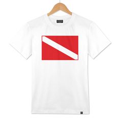 a white t - shirt with a red and white diagonal stripe on the chest, in front of a wooden hanger