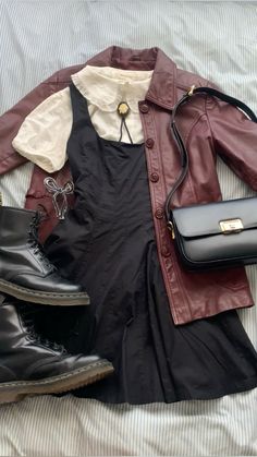 vintage 70s oxblood leather jacket black pleated pinafore dress peter pan collar cameo bolo tie doc martens vintage celine outfit inspo Wholesome Aesthetic Outfits, 70 S Outfits, Dark 70s Outfits, Beverly Marsh Outfits Aesthetic, Vintage Collared Leather Jacket For Fall, Leather Jacket Outfits Aesthetic, Dark Vintage Outfits, 70s Leather Jacket Outfit, Collared Dress Outfit