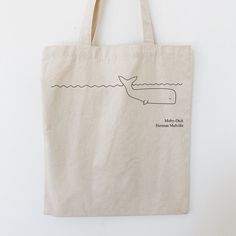 a tote bag with a whale drawn on it