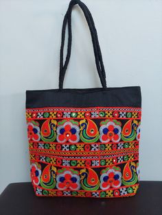 This beautiful bohemian design shoulder bag is part of our ethically sourced fairtrade bag collection. Pair it with ethnic and western outfits. It is very easy to carry with ample of space and will definitely boost your look and personality with the great artwork. Suitable for shopping, travel, beach, party, casuals this gorgeous piece is a must have if you are fond of art and like to carry ethnic accessories. This bag is handmade & hand stitched , as they are handmade and each bag is completely Multicolor Embroidery Hobo Bag For Festivals, Daily Use Cotton Shoulder Bag With Multicolor Embroidery, Black Shoulder Bag For Everyday Use And Festivals, Black Shoulder Bag For Everyday And Festivals, Traditional Cotton Shoulder Bag For Daily Use, Daily Use Shoulder Bag For Festivals, Multicolor Handwork Shoulder Bag For Daily Use, Multicolor Embroidered Shoulder Bag With Motifs For Everyday Use, Multicolor Embroidered Cotton Shoulder Bag For Everyday Use