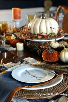 White pumpkin centerpiece on blue and orange Thanksgiving table. Blue Thanksgiving Table Decor, Blue Thanksgiving Table, Traditional Thanksgiving Table, Thanksgiving Decorations Table, Autumn Gathering, Blue Thanksgiving, Harvest Theme, Thanksgiving 2023