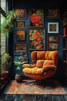 an orange chair sitting in front of a bookshelf filled with lots of pictures