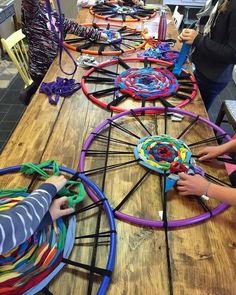 several children are playing with colorful toys on a table