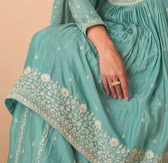 COLOR : Sea Green FABRIC : Top, Bottom & Dupatta - Premium Chinon Silk WORK : Resham Embroidery, Hand Work, Sequins, Motifs, Lace Border OCCASION : Wedding, Reception, Party Wear, Festival READY-TO-WEAR : No STITCHING : Available as semi-stitched fabric, can be stitched using standard size option (+$30). Note: There might be a slight color variation due to lighting and flash used during photoshoot. The bright shade seen is the best closer view of fabric's color. Turquoise Semi-stitched Sharara With Zari Work, Unstitched Light Blue Sharara With Resham Embroidery, Blue Semi-stitched Raw Silk Sharara, Luxury Turquoise Semi-stitched Sharara, Semi-stitched Turquoise Sharara, Green Sharara Suit, Embroidery Hand Work, Green Sharara, Resham Embroidery