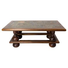 a wooden coffee table with two wheels on each side and a stone top in the middle