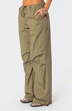 A baggy, Y2K-inspired fit gives you room to move in these lightweight, stretch-kissed cotton pants featuring utilitarian drawcords and cargo pockets. Drawcord-toggle waist Front slant flap pockets; back flap patch pockets; cargo flap-patch pockets Drawcord-toggle cuffs 95% cotton, 5% spandex Machine wash, dry flat Imported Military Cotton Cargo Pants With Elastic Waistband, Military Style Cotton Cargo Pants With Elastic Waistband, Sporty Cotton Parachute Pants For Work, Khaki Cotton Techwear Bottoms, Versatile Relaxed Fit Cotton Parachute Pants, Versatile Cotton Parachute Pants With Relaxed Fit, Versatile Cotton Relaxed Fit Parachute Pants, Everyday Utility Parachute Pants With Cargo Pockets, Utility Parachute Pants With Cargo Pockets For Everyday