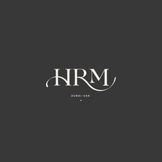 the word hrm is written in black and white on a dark background with an elegant font