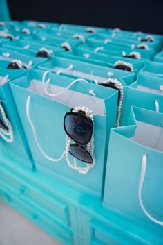 many bags with sunglasses and pearls on them