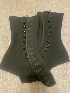 Pair of women's Tweedie boot tops of black wool with 14 side buttons on each.  These are small, probably around a size 5 or 6. I will send measurements if requested. VERY good condition for being over 100 years old, they look barely used, like they just came out of the box. Perfect for steampunk!  Charles Tweedie patented Tweedie Boot Tops in 1915 and 1918 and they were very popular in the 1920s. They were called a "boot top" - the term more pleasing than "spat" and were made and sold by the Tweedie Boot Top Company, St. Louis, Missouri. The company slogan was "a pair fitted is a pair sold". A label was sewed in every pair as a guarantee of quality and to discourage imitators. Vintage Fall Corset, Vintage Fitted Corset For Fall, 1920s Shoes, Victorian Boots, Clothing Reference, Company Slogans, St Louis Missouri, Adult Costumes, Black Wool