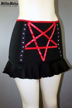 DETAILS Custom-made pentagram mini skirt created using red satin ribbon with black grommet tape on the front and a red elastic waist band. LENGTH: 13" (fits at hip) MODEL: Mannequin has 37" hip VIEW SIZE GUIDE CARE: Hand wash cold, hang dry. SHIPPING: Made When Ordered Please allow 1-2 WEEKS to ship. Red Mini Skirt For Alternative Fashion, Red Mini Skirt For Cosplay, Emo Fitted Mini Skirt For Cosplay, Stretch Mini Skirt For Cosplay, Emo Style Fitted Mini Skirt For Party, Gothic Stretch Mini Bottoms, Emo Mini Skirt For Halloween Cosplay, Halloween Stretch Mini Skirt, Emo Fitted Mini Skirt