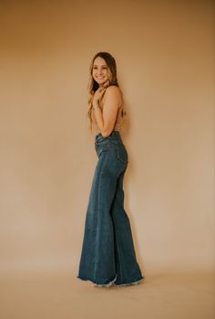 Cute wide leg trouser flare jeans for women. Dark wash jean styled as a chic western outfit. Fall Dark Wash Wide-leg Jeans, Fall Medium Wash Wide Leg Flares, Dark Wash Full Length Flares With Frayed Hem, Dark Wash Full-length Flares With Frayed Hem, Wide Leg Denim Blue Flares For Fall, Denim Blue Wide Leg Flares For Fall, Fall Denim Blue Wide Leg Flares, Dark Wash Denim Flares With Frayed Hem, Dark Wash Denim Wide Leg Pants For Fall