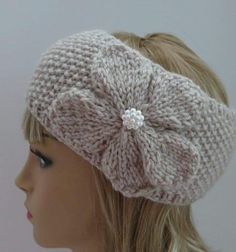 a close up of a mannequin head wearing a knitted hat