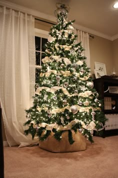 a decorated christmas tree in a living room