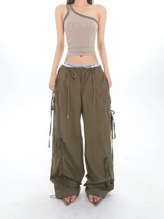 Experience unparalleled comfort and effortless style with our Cargo Drawstring Jogger Pants, complete with multiple pockets for convenience. Crafted from a soft blend of premium polyester fibers, these joggers boast a natural waist fit and a relaxed cut, perfect for both street-inspired looks and laid-back days. Their drawstring closure ensures a custom fit, while the simple yet functional design, including a ventilated weave for breathability, enhances your everyday wear. Pull off a nonchalant Khaki Drawstring Long Pants, Sporty Khaki Pants With Drawstring, Utility Khaki Bottoms With Functional Drawstring, Baggy Ankle-length Cargo Pants With Drawstring, Military Style Cotton Parachute Pants With Hip Pockets, High-waisted Parachute Pants With Drawstring For Streetwear, Utility Wide-leg Parachute Pants With Drawstring, High-waisted Parachute Pants With Multiple Pockets For Streetwear, Grunge Accessories