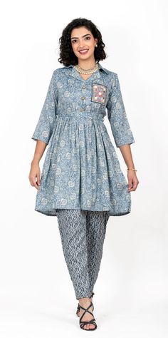 This luxurious cord-set features a printed shirt with a timeless, ornamental collar and a delicate tie-knot waist belt, accompanied by a pair of dhoti pants printed with a tasteful combination of patterns. Offered in four different sizes from M to XL About Pironah Discover Pironah, your go-to for Indo-Ethnic and Fusion Wear on Etsy! 🌟 From Silk Suits to Anarkalis, trendy Co-ord Sets, and many more, our curated collection blends tradition and contemporary style. Shop exclusively at https://www.p Elegant Cotton Sets With Block Print, Elegant Cotton Block Print Sets, Elegant Block Print Cotton Sets, Traditional Semi-formal Straight Kurta Set, Transitional Cotton Palazzo Set With Printed Motifs, Cotton Semi-formal Festive Sets, Festive Cotton Semi-formal Sets, Traditional Ikat Print Sets For Spring, Festive Semi-formal Cotton Sets