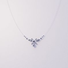 Introducing Blossom: Crafted as a romantic high-end floral necklace to complement any of our other pieces as a set or to shine brightly on it's own. This classical necklace is perfect for any occassion. As a gift for her, a supplement to an engagement ring or a gift for yourself - because you deserve it - it is guaranteed to impress. A bright and shiny string of simulated diamonds make this necklace stand out and is sure to bring lots of compliments. Each stone shines brightly to perfection and Dainty Sparkling Necklace For Party, Sparkling Dainty Jewelry As Gift, Mother's Day Party Sterling Silver Necklace, Delicate Sparkling Diamond White Jewelry, Delicate Jewelry For Mother's Day Party, Delicate Cubic Zirconia Necklace For Party, Dainty Sterling Silver Necklace For Party, Dainty White Gold Necklace With Sparkling Stones, Delicate Crystal Necklace For Formal Occasions