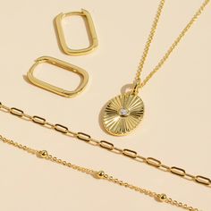 Our Gold Filled Oval Sun Necklace is an accessory that shines its way into your heart! With a 14k gold-filled hammered coin pendant, a beaded chain and a gorgeous round circumference of 16.2mm, this necklace adapts to you easily with its adjustable length. And don't worry about it getting wet or tarnished, because it's waterproof, hypoallergenic and resistant to corrosion - you can wear it fearlessly! - 14k gold-filled- Circle circumference: 16.2 mm. - Adjustable chain length: 16" + 2" extension Everyday Hammered Oval Jewelry, Everyday Oval Hammered Jewelry, Gold Plated Oval Hammered Jewelry, Oval Gold Plated Hammered Jewelry, Oval Coin Pendant Jewelry For Everyday, Everyday Oval Coin Pendant Jewelry, Oval Pendant Paperclip Chain Jewelry Gift, Gift Jewelry With Satellite Chain And Oval Link, Gift Satellite Chain Jewelry With Oval Link