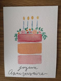 a piece of cake with candles and flowers on it that says, genyeu universaire