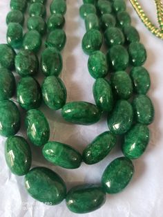 AAA 734 Carat Emerald beryl Oval Shape Fine Quality Smooth Beads With Adjustable Cord Necklace Stone : Emerald beryl Shape :- Oval Size :-6x8 - 12x17mm length - 18 inch, 3 line strings Weight :- 734 carat Polish :- Handmade color - green It is known as the 'love stone' as the message it emits is the strong vibration of unconditional love, joy, warmth and healing. As quartz crystals are profound amplifiers of energy, it may help to kindle happiness, love, romantic feelings and sensuality. It is g Oval Jade Bead Necklace With Polished Finish, Jade Necklace With Polished Oval Beads, Jade Necklaces With Polished Oval Beads, Elegant Gemstone Oval Beads, Oval Emerald Bead Necklace For Jewelry Making, Emerald Necklace With Oval Gemstone Beads For Jewelry Making, Artisan Gemstone Oval Beads, Green Oval Gemstone Bead Necklace, Oval Gemstone Beads For Jewelry Making