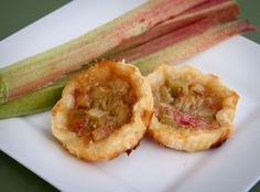 some food is on a white plate with celery sticks and another item in the background