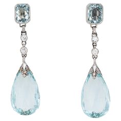 Elegant pair of vintage Art Deco era aquamarine & diamond earrings (circa 1920s to 1930s) crafted in 900 platinum. Briolette faceted aquamarines measure 18mm x 12mm (lower) and square cushion cut aquamarines measure 7mm x 5mm. Four old European cut diamonds total an estimated 0.20 carats (estimated at I-J color and SI1-2 clarity). The opulent earrings transcend eras and are as wearable today as they were nearly 100 years ago. Meticulously crafted in platinum with etched foliate and milgrain deta Opulent Earrings, Mafia Princess, Art Deco Jewelry Vintage, 1920s Vintage, Edwardian Jewelry, Silver Jewelry Fashion, Art Deco Earrings, Deco Jewelry, Art Deco Diamond