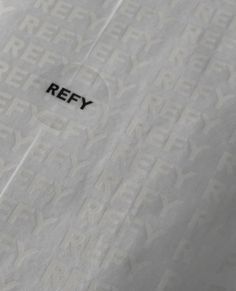 the word refy is written on a piece of white paper with black letters in it