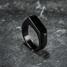 A simple but stylish way to keep your loved one with you at all times. A small quantity of ashes can be inserted into the ring by removing the screw cap to reveal a cavity below. Comes complete with the accessories needed to safely insert the ashes. Black Minimalist Signet Ring For Everyday, Adjustable Black Minimalist Signet Ring, Minimalist Matte Black Jewelry For Gifts, Minimalist Matte Black Jewelry Gift, Black Stainless Steel Signet Promise Ring, Minimalist Black Signet Promise Ring, Black Stainless Steel Jewelry For Memorial, Modern Matte Black Jewelry For Gifts, Modern Matte Black Jewelry As Gift