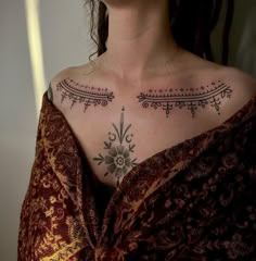 a woman with a tattoo on her chest