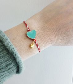 Red white string with turquoise enamel heart and evil eye bracelet, Heart enamel March bracelet, Red and white Spring adjustable bracelet, Greek Martis, March protection bracelet Details: * Gold plated flower bead * Gold plated enamel bead * Red white twisted thread * The bracelet is adjustable The "Marti bracelet" or just "Marti" is an ancient custom for the beginning of Spring. It is believed it dates back to ancient Greece and it is known all over the Balkans. The name is derived from the Gre Handmade Green Heart-shaped Bracelet, Heart-shaped Adjustable Bracelets As Gift, Turquoise Heart Beads Bracelet As Gift, Turquoise Heart Beads Bracelet Gift, Turquoise Heart Beads Bracelet For Gift, Turquoise Jewelry With Adjustable Length For Gifts, Handmade Green Heart Bracelets, Handmade Green Heart-shaped Bracelets, Heart Shaped Friendship Bracelets With Heart Beads As Gift