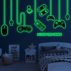 a bedroom with neon lights and video game controllers on the wall