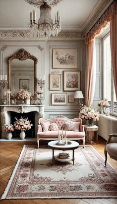 a living room filled with furniture and a chandelier above a fire place in front of a fireplace