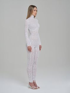 Elevate your style with the White Lace Bodysuit Long Sleeve, the crowning jewel of our collection and the foundation of our brand. This exquisite piece redefines elegance, merging the allure of a sexy bodysuit with the sophistication of black lace. Designed to be your new second skin, it features full-length, one-piece construction with our innovative "smart" lower back zippers for unparalleled convenience. Crafted from 100% nylon, this bodysuit boasts a turtleneck and long sleeves, offering a silhouette that's both effortlessly sexy and sleek. Its versatility shines through the ability to transform any outfit – layer it under a jacket or pair it with an oversized shirt for a look that's uniquely yours. The white lace bodysuit outfit becomes a canvas for your creativity, allowing you to ex White Lace Bodysuit Outfit, Lace Bodysuit Outfit, Full Bodysuit, White Lace Bodysuit, Bodysuit Outfit, Body Suit Outfits, Sheer Long Sleeve, Layering Outfits, Long Sleeve Turtleneck