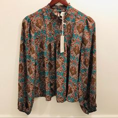 Joie Blouse Long Sleeves With Elastic Cuffs High Neck Collar Keyhole Back With Button Closure 100% Poly Bold Paisley Print In Brown, Teal Green, Pink, And Off White Available In Sizes Small And Xs New With Tags Fitted Paisley Print Blouse For Work, Vintage Boho Print Top For Fall, Fall Vintage Boho Print Tops, Fitted Long Sleeve Blouse With Paisley Print, Fall Paisley Print Tops For Work, Fall Paisley Print Work Tops, Long Sleeve Tops With Paisley Print For Work, Fitted Paisley Print Tops For Work, Vintage Boho Print Blouse For Fall