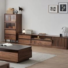 a living room scene with focus on the coffee table and entertainment unit in the background