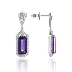 These Elegant Flowing Earrings contain 2 Elongated "emerald cut" Genuine Gemstones weighing approx 7.20cttw, beautifully accented with 134 Round Brilliant Diamonds (.46cttw) set in 14k White Gold. Choose Blue Topaz or Amethyst! With the slightest motion each dangle earring shimmers brightly in the day and moonlight! Fine Jewelry Bridal Drop Earrings, Elegant Prong Set Drop Earrings, Fine Jewelry Gemstone Earrings For Evening, Elegant Drop Earrings With Prong Setting, Evening Gemstone Earrings In Fine Jewelry Style, Formal Dangle Earrings Fine Jewelry, Luxury Diamond Earrings With Gemstones For Formal Occasions, Luxury Diamond Gemstone Earrings For Formal Occasions, Luxury Gemstone Drop Earrings