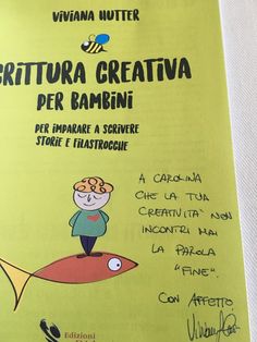 a yellow book with an image of a boy on top of a fish and the words crittura creativva per bamni