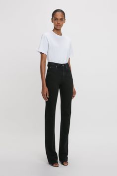 A favourite from the house’s denim library, the Julia Jean is reimagined in a Washed Black stretch denim exclusively for AW24. Characterised by a high waistline, straight leg and relaxed fit, the Julia is tailored from soft 100% cotton denim for a casual but sophisticated look. A silver branded denim shank button and copper branded rivets, tobacco topstitching and a branded leather patch at the back of the waist reflect the house’s consistent attention to detail. Styled with the Victoria T-Shirt Straight Leg Jeans Black, Straight Leg Black Jeans, High Waisted Jean, Shank Button, Leather Patches, Black Stretch, Rivets, Victoria Beckham, High Waist Jeans