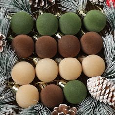 christmas decorations with pine cones and green balls