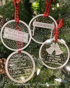 three personalized christmas ornaments hanging from a tree