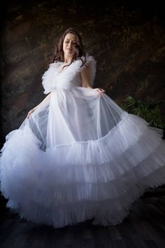 White Tulle Maternity Dress, Photoshoot Gown, White Sheer Dress Beautiful tiered tulle maternity dress with ruffles on top part. Dress is lined on bottom part. It will be a great dress for your maternity photoshoot. Dress is adjustable Fabric: tulle, cotton blend linen Length: floor length with train You can also order it as mother daughter matching set. Baby dress price - 90$ Dress is available in different colors. Contact me about color you wish. Additional cost in other color may be applied D White Tulle Floor-length Ball Gown, White Floor-length Tulle Ball Gown, White Ruffled Ball Gown For Wedding, White Ruffle Dress For Debutante Ball, White Ruffles Dress For Debutante Ball, White Tulle Ball Gown With Ruffles, White Tulle Dress For Bridal Shower, White Tulle Dress For Bride, White Ruffled Wedding Gown