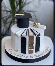 a graduation cake with books on top