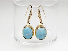 Turquoise Glass earrings, a timeless classic perfect for any occasion.   Sparkling earrings feature oval faceted Glass drops framed in 16K Gold-plated brass gracefully dangling from Gold-plated Cubic Zirconia ear wires.  Dainty earrings measure 1 1/4 inches from top to bottom and the faceted glass drop is 1/2 inch wide.  Silicone backs included.  These dainty earrings make lovely bridal earrings, birthday gifts as well as a thoughtful sister gift, mom gift and a brilliant gift for you.  Why not Oval Faceted Earrings As Gift, Oval Faceted Earrings For Gift, Formal Turquoise Oval Earrings, Turquoise Oval Earrings For Anniversary, Oval Turquoise Earrings For Anniversary, Elegant Oval Faceted Earrings, Formal Oval Faceted Earrings, Elegant Oval Turquoise Jewelry, Elegant Faceted Turquoise Earrings