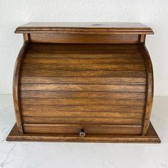 a wooden box sitting on top of a white counter