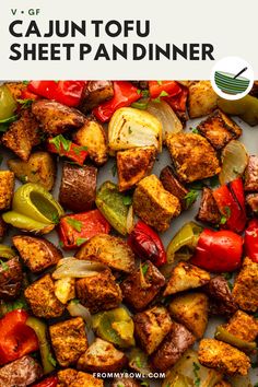 an image of a sheet pan full of food with the title cajun tofu sheet pan dinner