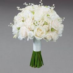 a bridal bouquet with white roses and baby's breath