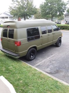 an old van is parked in the parking lot