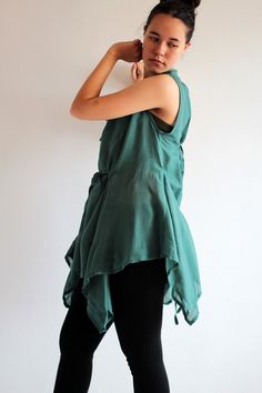 "A unique, funky, versatile piece. Great overlay blouse that can be worn alone in at least 6 different ways! The blouse has a round drawstring neckline with a flowing wide body part. The design is made from one big piece of square shaped fabric gathered in the front and back. An unusual design with many pointy hem lines. You can adjust the blouse and wear it off the shoulder, or with a very low neckline. Triangular pieces hang on the side with ties that can be tied at the side, to the front or t Cotton Tunic Tops For Layering, Cotton Tops Free Size For Spring, Spring Cotton Free Size Tops, Asymmetrical Lagenlook Summer Blouse, Summer Lagenlook Asymmetrical Blouse, Summer Lagenlook Blouse, Asymmetrical Hem Cotton Blouse In Lagenlook Style, Cotton Lagenlook Blouse With Asymmetrical Hem, Bohemian Cotton Blouse For Layering